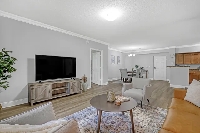 a kitchen with stainless steel appliances granite countertop a refrigerator stove and microwave