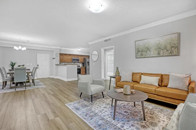 a kitchen with stainless steel appliances granite countertop a refrigerator stove and microwave