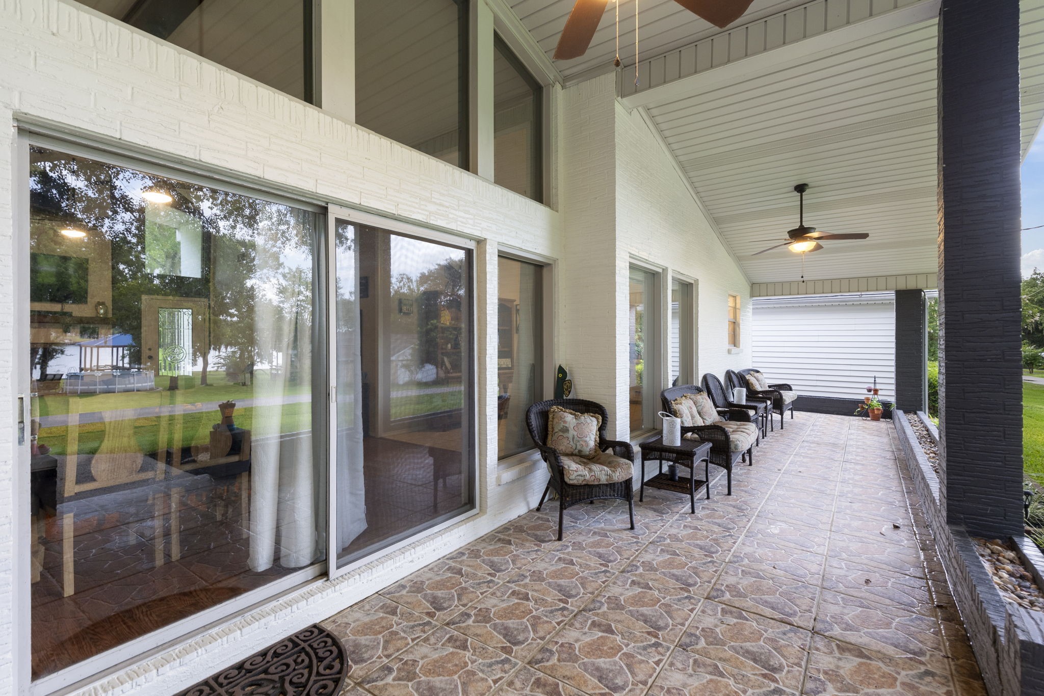 245 Lakeland Road Huntsville, TX 77320 - Photo 36 of 49 Enjoy the view of the lake as you relax on your covered back patio