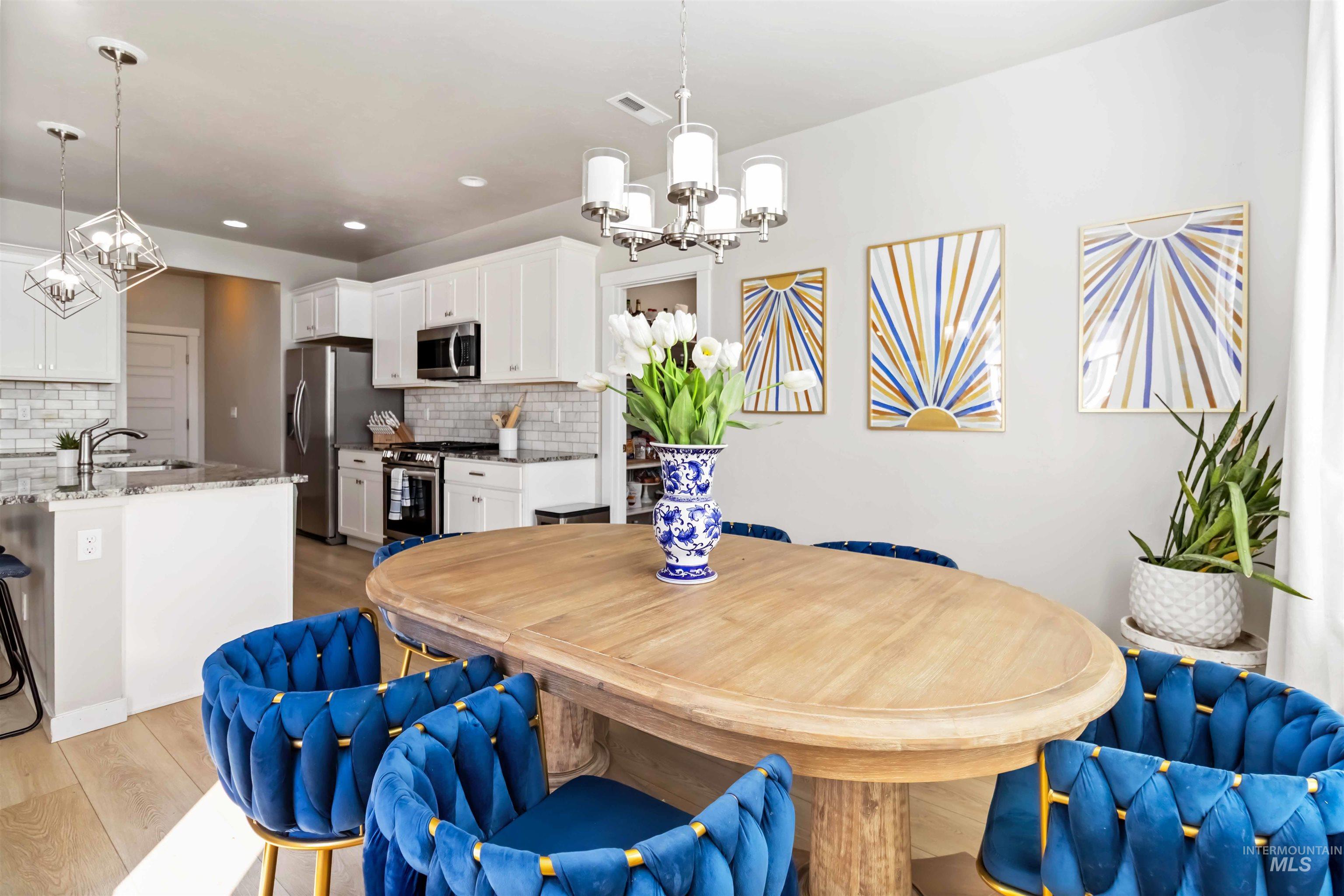 892 North Chastain Lane Eagle, ID 83616 - Photo 14 of 45 Dining room with a chandelier, light wood finished floors, and recessed lighting