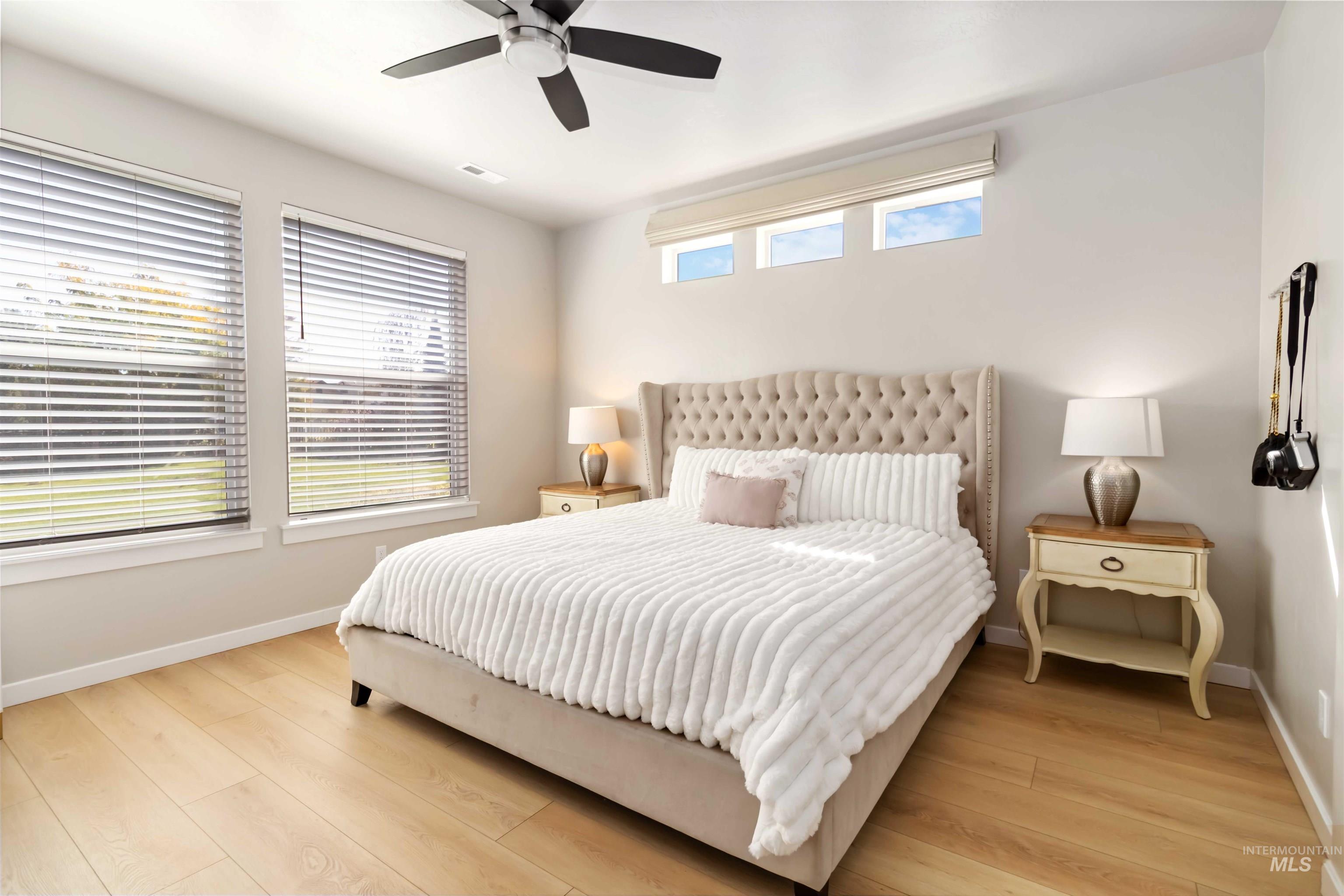 892 North Chastain Lane Eagle, ID 83616 - Photo 18 of 45 Bedroom featuring light wood-style flooring and a ceiling fan