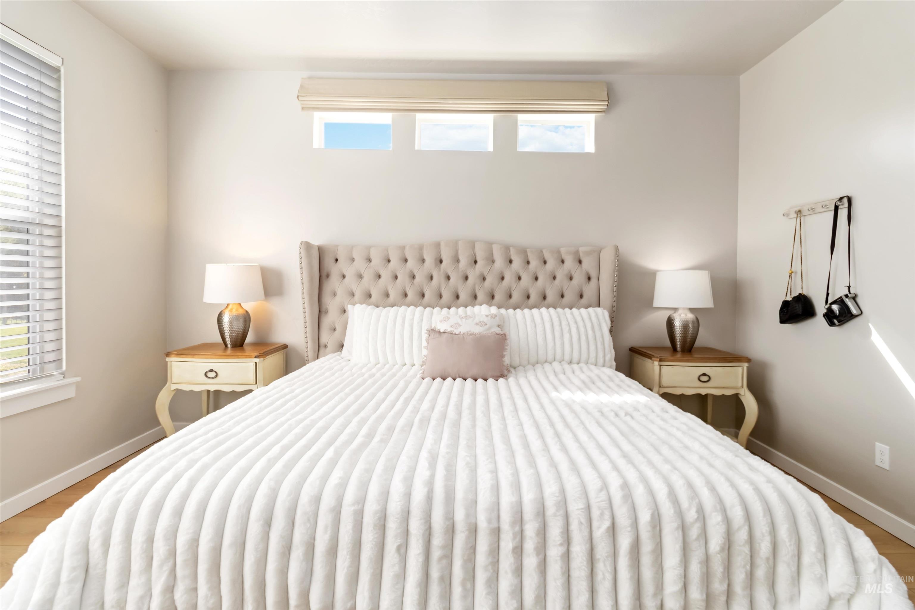 892 North Chastain Lane Eagle, ID 83616 - Photo 19 of 45 Bedroom with baseboards and wood finished floors