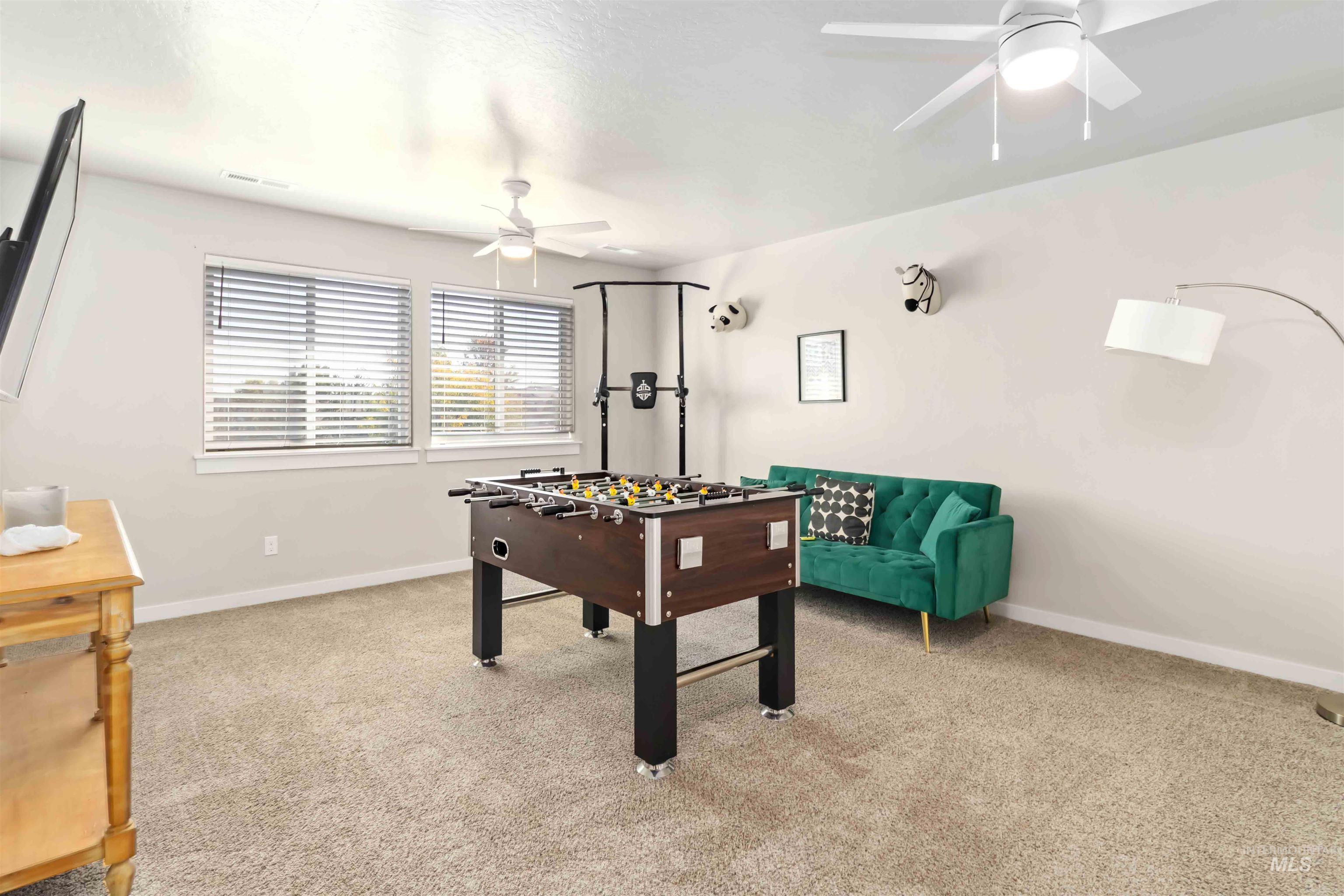 892 North Chastain Lane Eagle, ID 83616 - Photo 26 of 45 Playroom with light colored carpet and ceiling fan