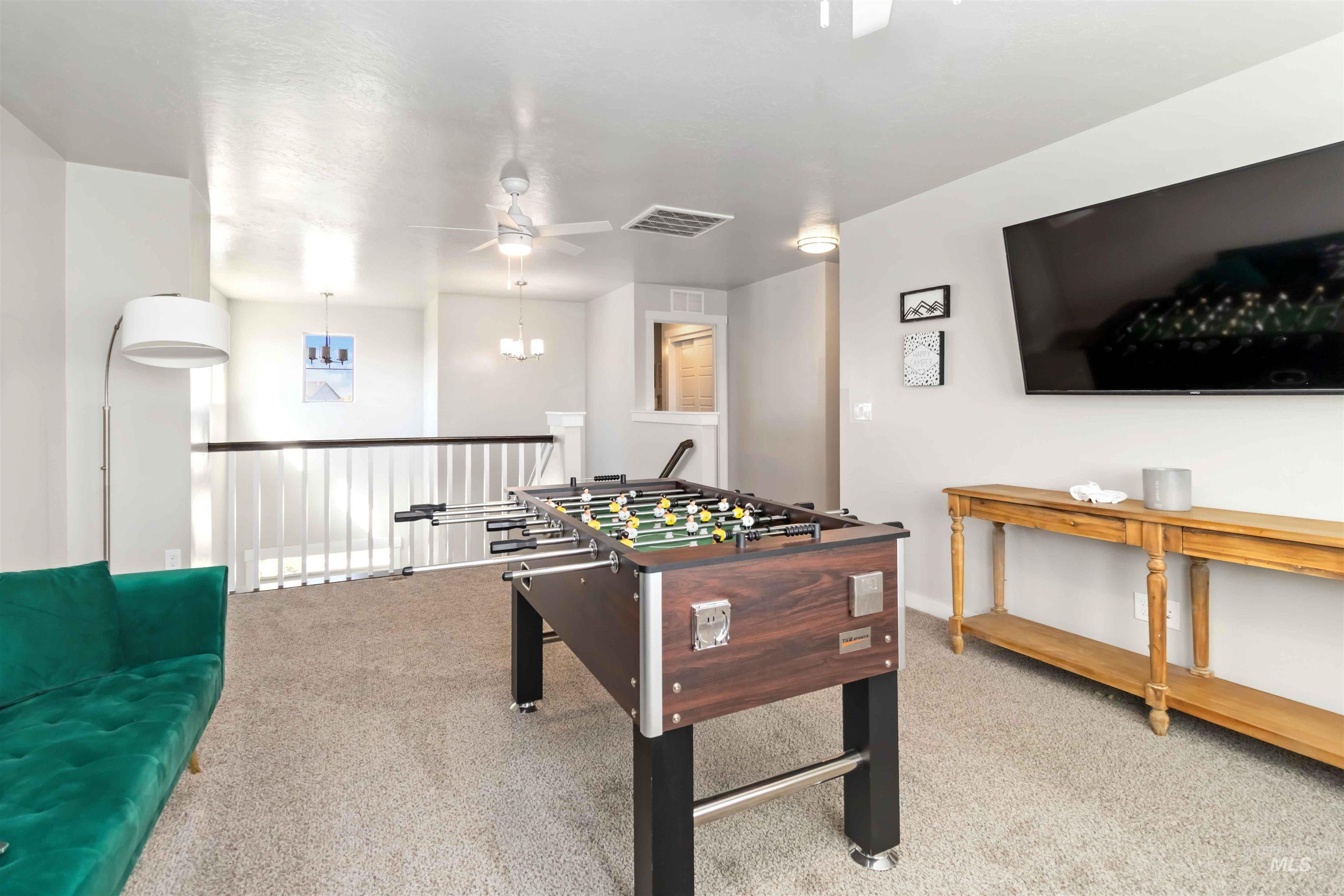 892 North Chastain Lane Eagle, ID 83616 - Photo 29 of 45 Game room with light carpet and ceiling fan