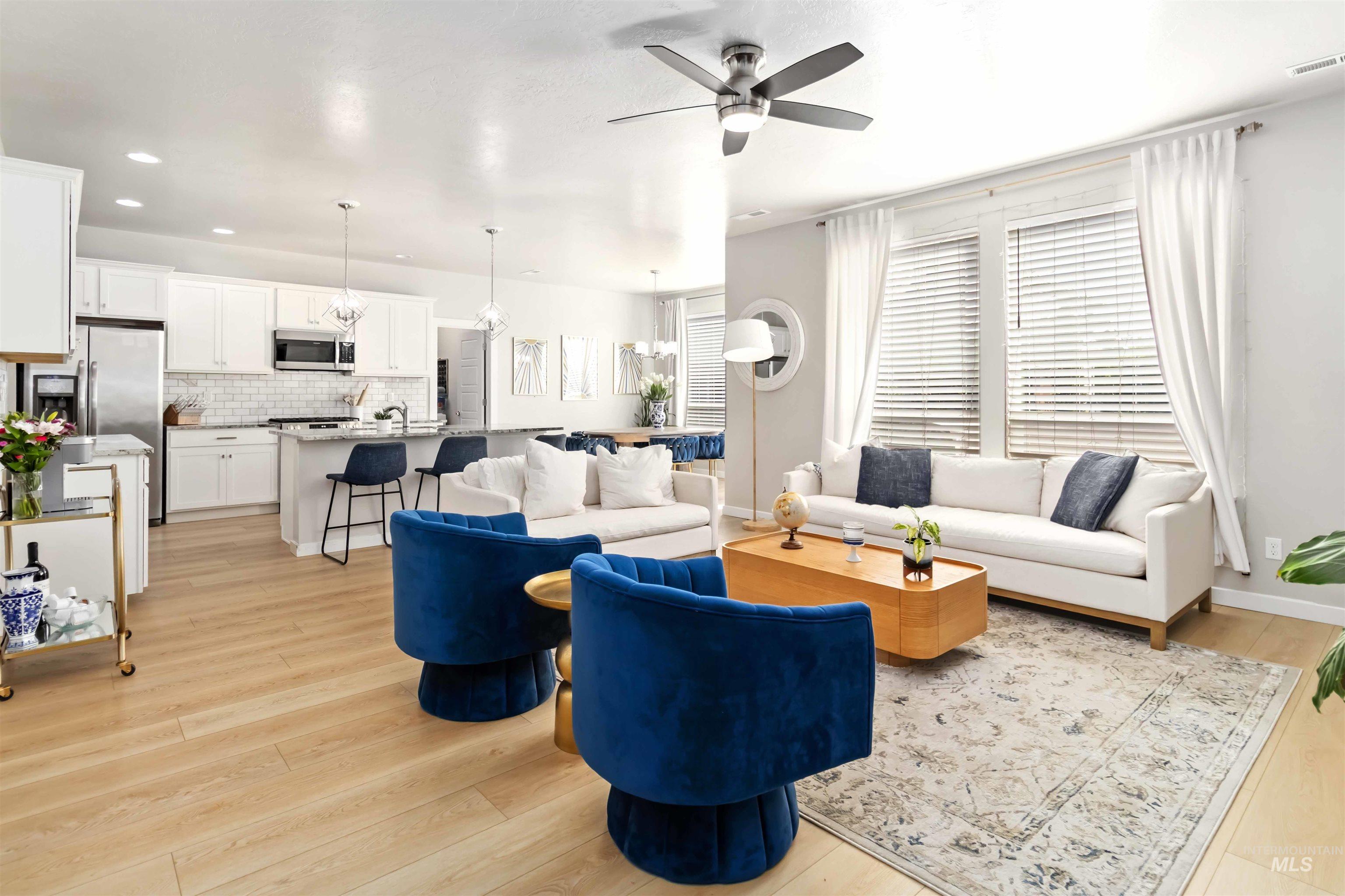 892 North Chastain Lane Eagle, ID 83616 - Photo 3 of 45 Living room featuring ceiling fan, light wood-type flooring, and recessed lighting