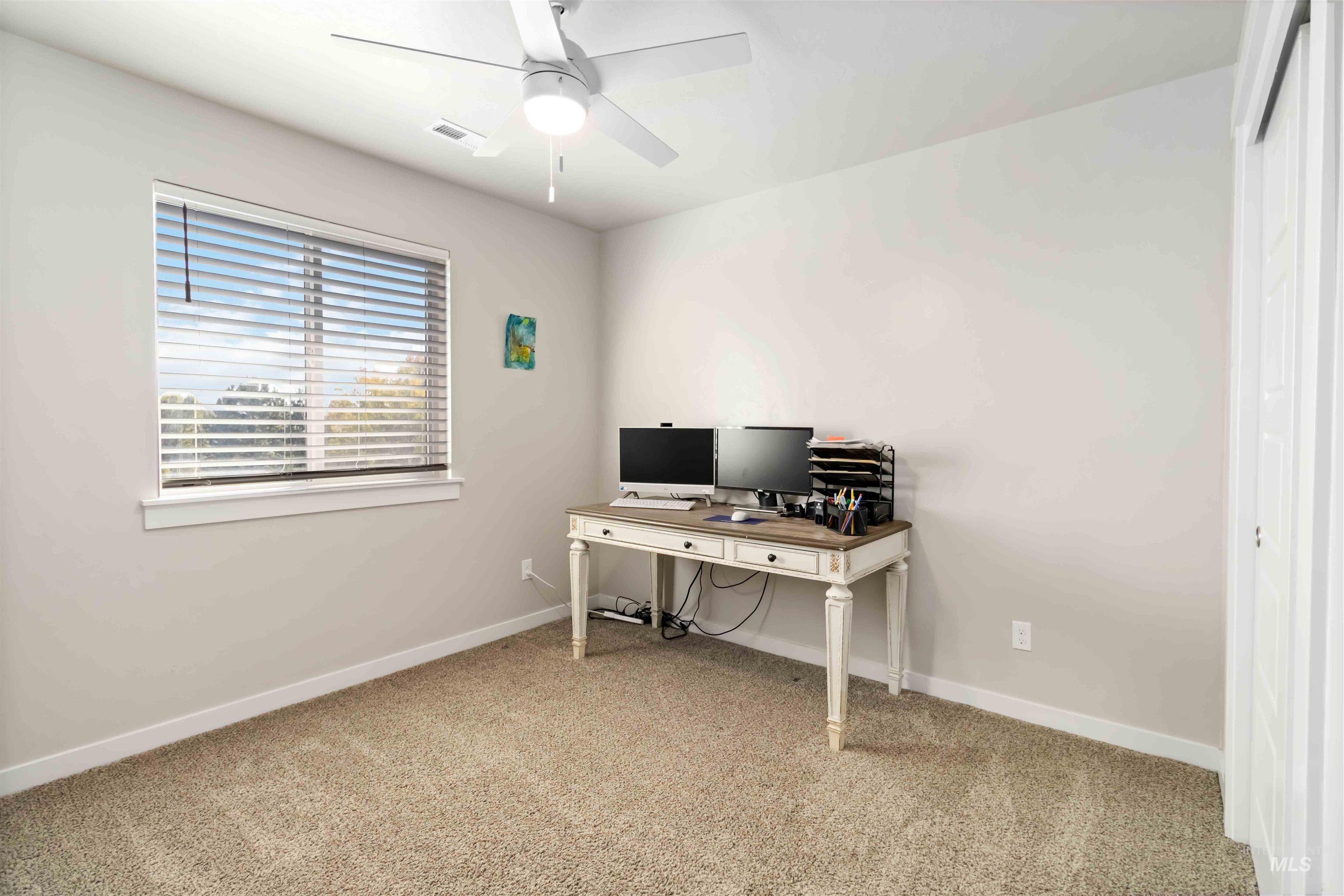 892 North Chastain Lane Eagle, ID 83616 - Photo 34 of 45 Office area featuring light colored carpet and a ceiling fan