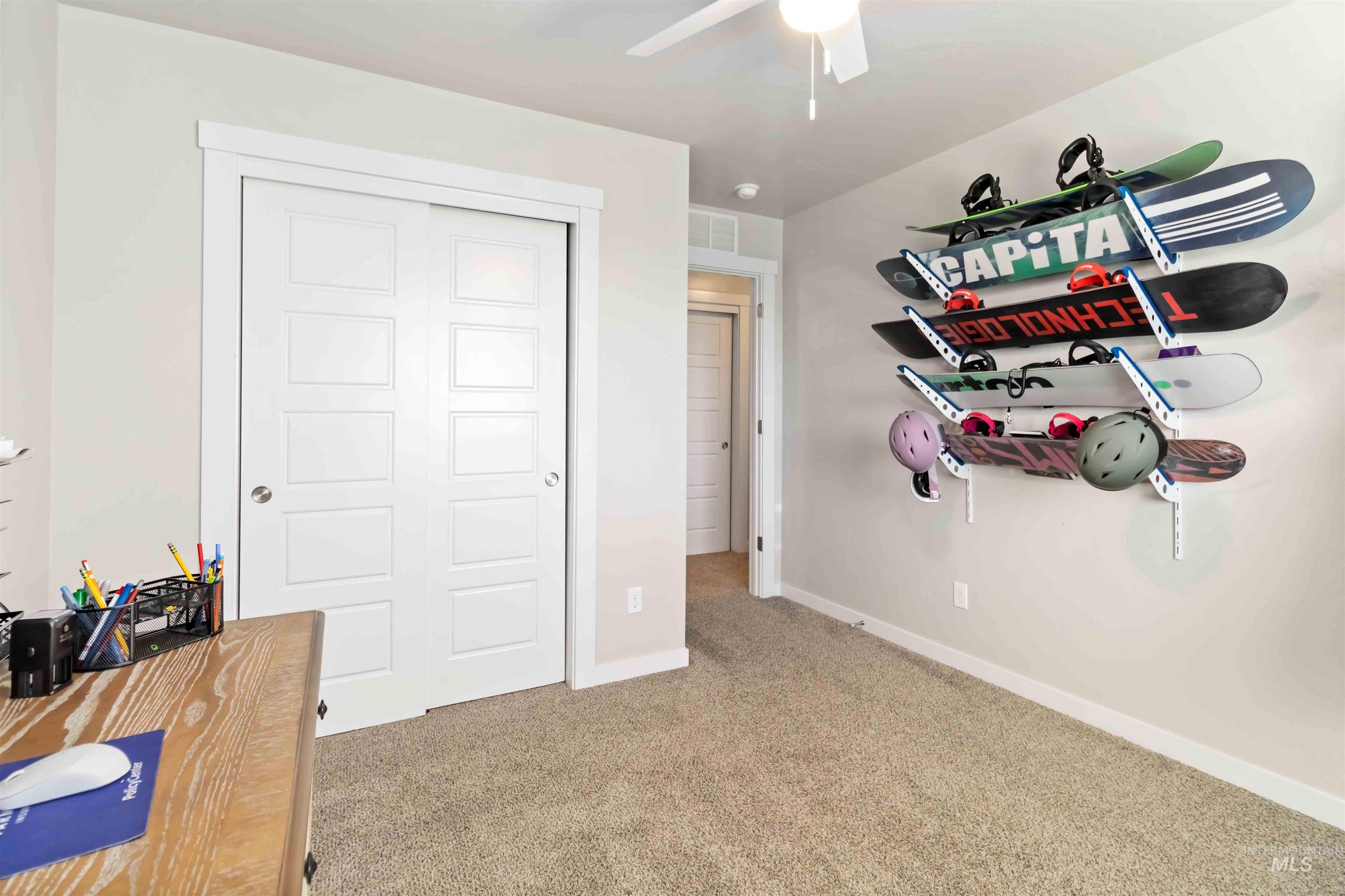 892 North Chastain Lane Eagle, ID 83616 - Photo 35 of 45 Bedroom featuring light colored carpet, a closet, and a ceiling fan