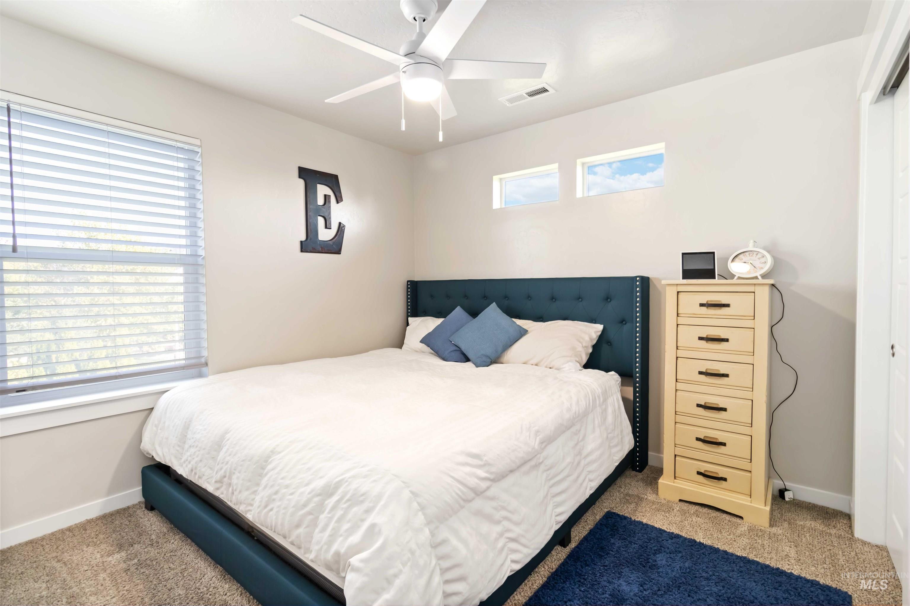 892 North Chastain Lane Eagle, ID 83616 - Photo 36 of 45 Carpeted bedroom featuring baseboards and ceiling fan