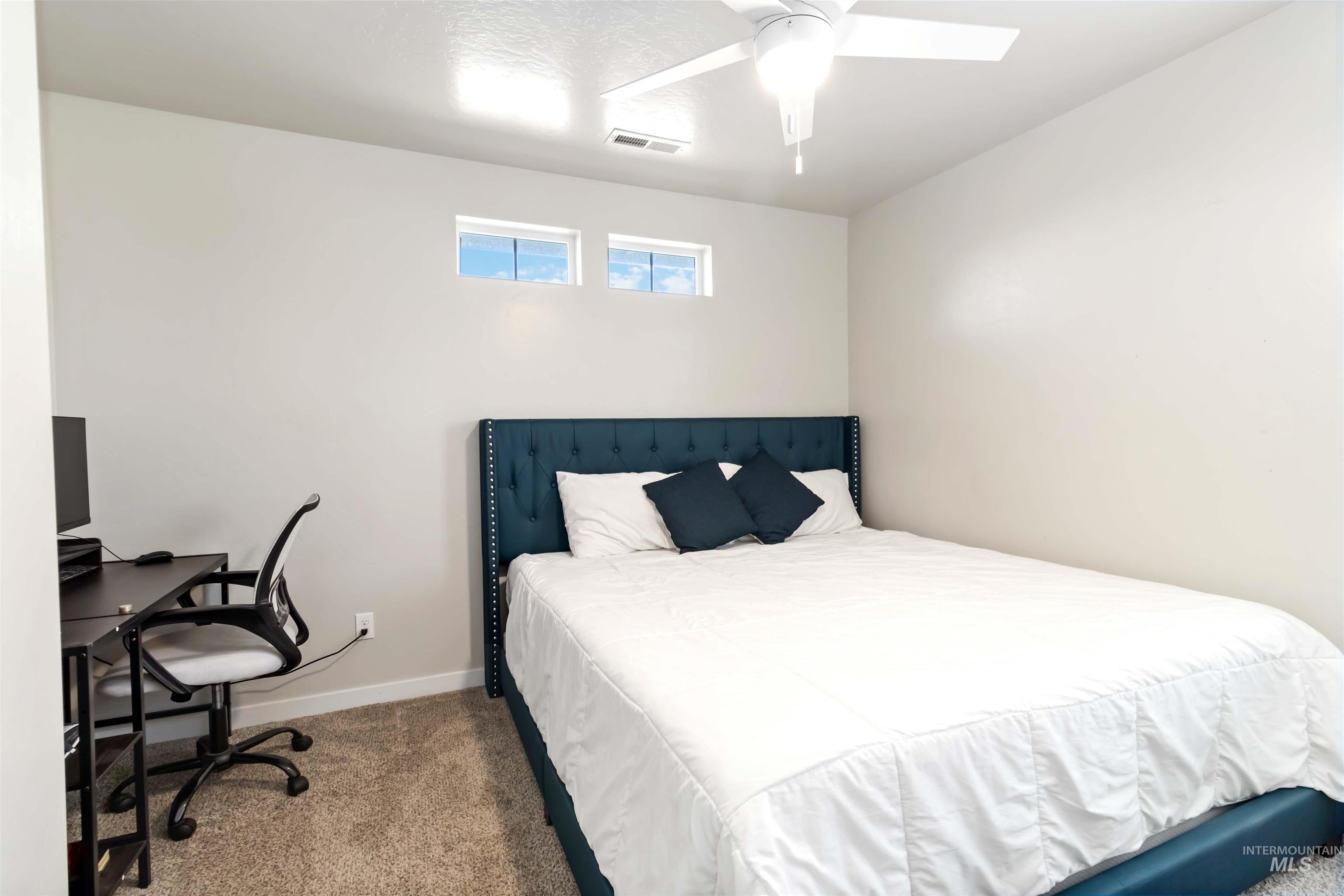 892 North Chastain Lane Eagle, ID 83616 - Photo 37 of 45 Bedroom with carpet flooring, a desk, and ceiling fan