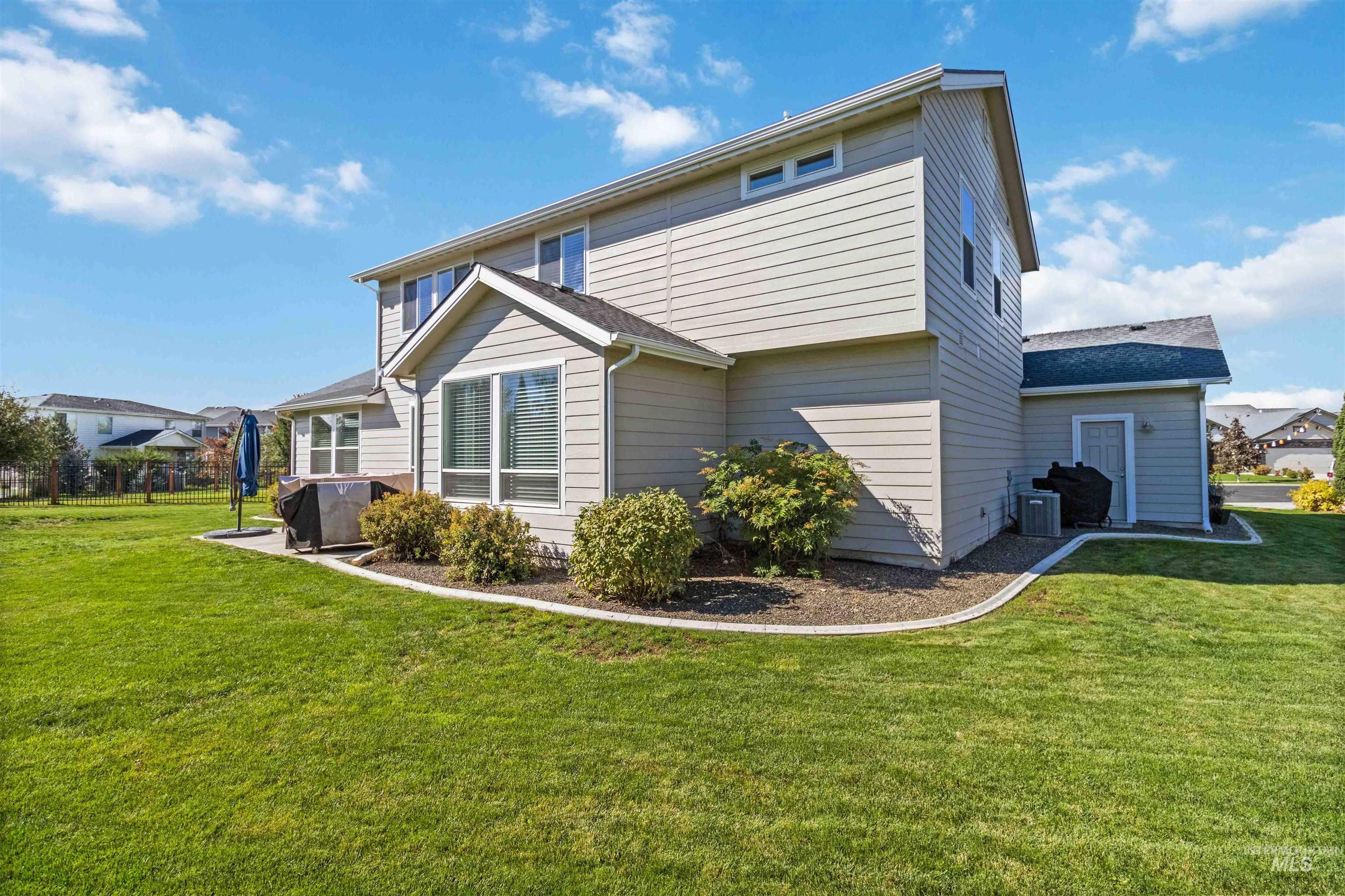 892 North Chastain Lane Eagle, ID 83616 - Photo 41 of 45 Back of property with a lawn