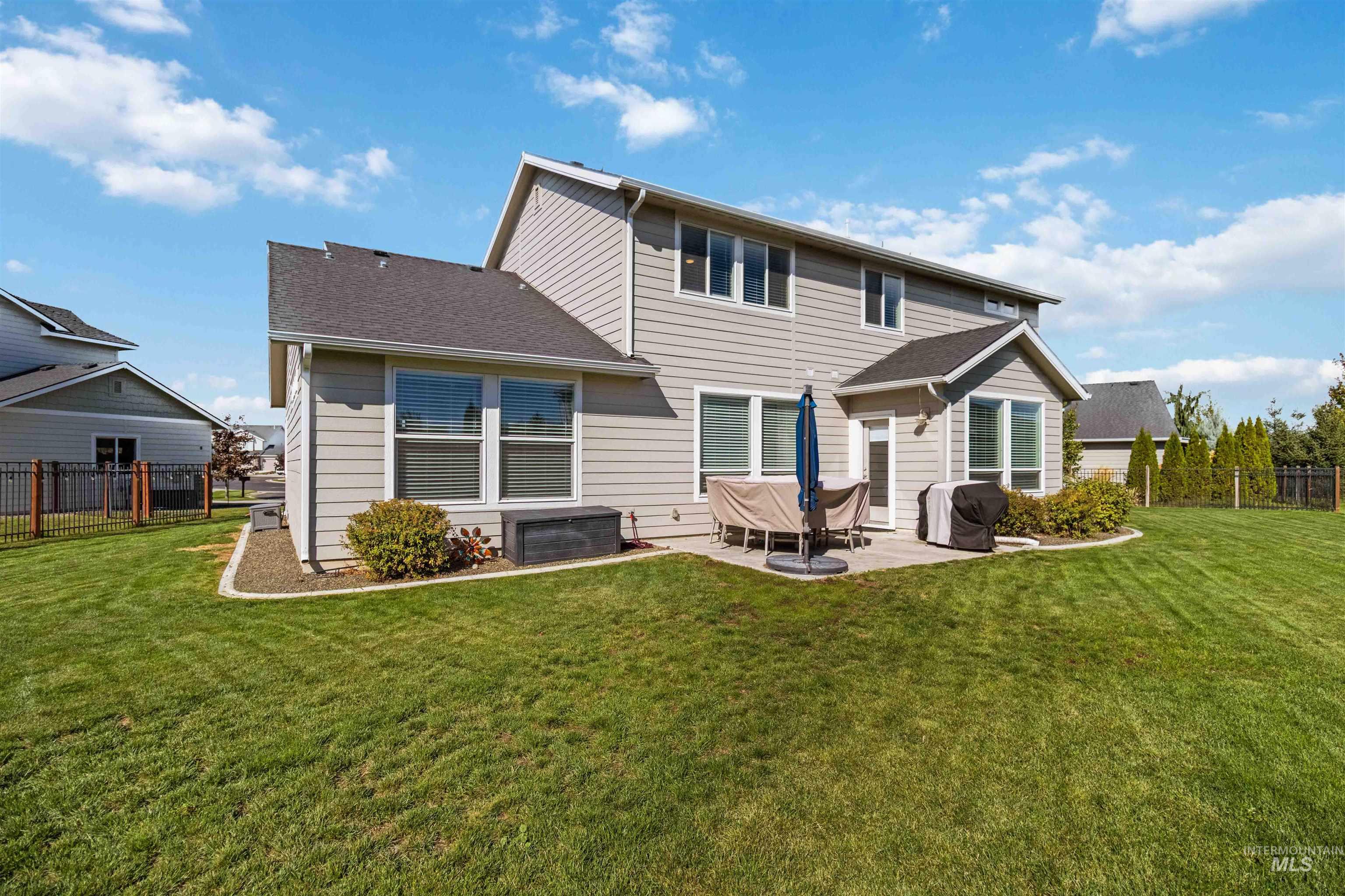 892 North Chastain Lane Eagle, ID 83616 - Photo 45 of 45 Back of property featuring a patio and a shingled roof