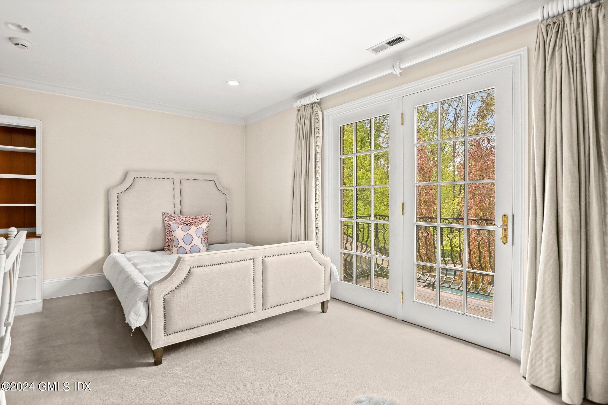 376 Westover Road Stamford, CT 06902 - Photo 30 of 37 a bedroom with a bed and a large window