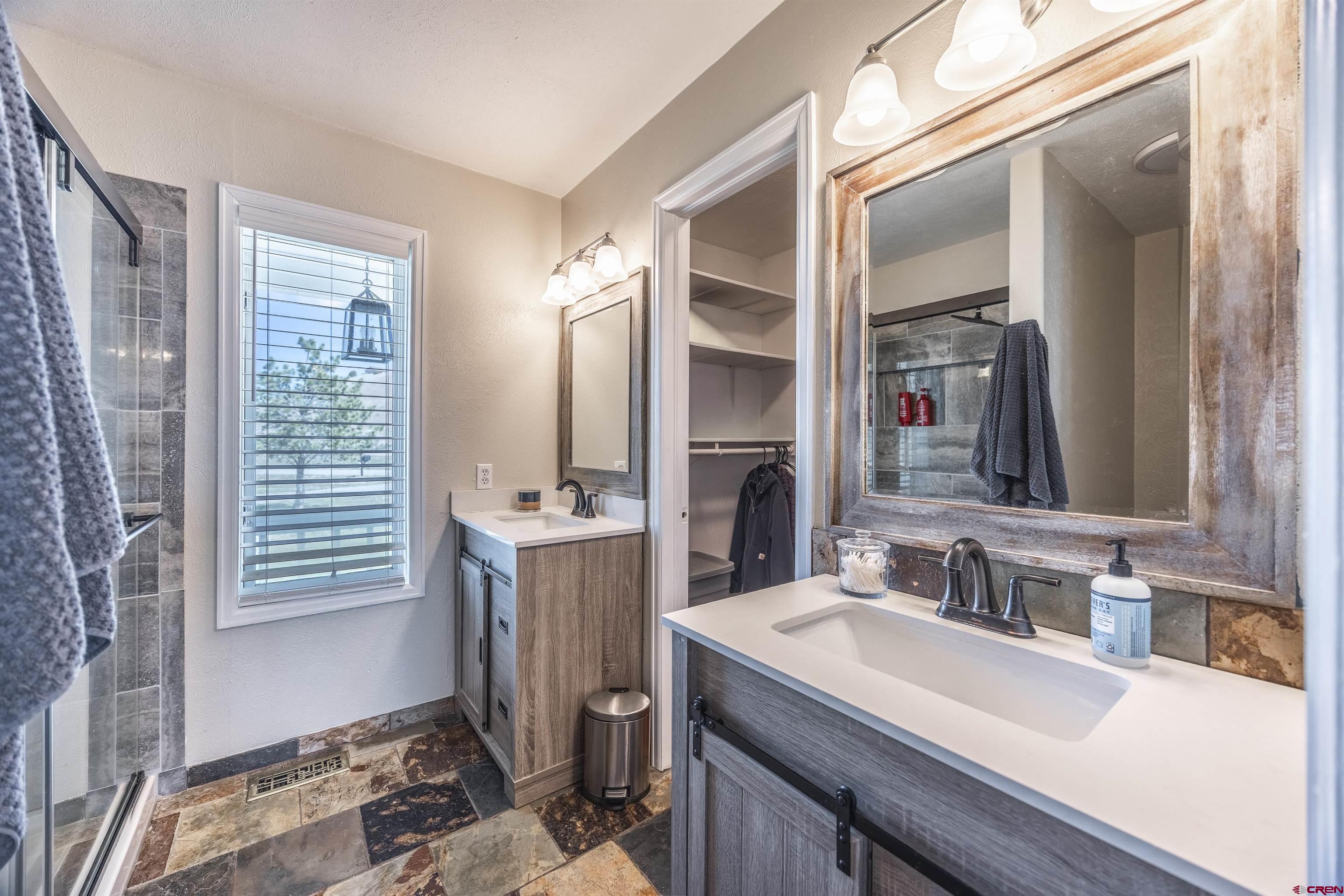 19555 6575th Road Montrose, CO 81403 - Photo 12 of 36 a bathroom with a sink and a mirror