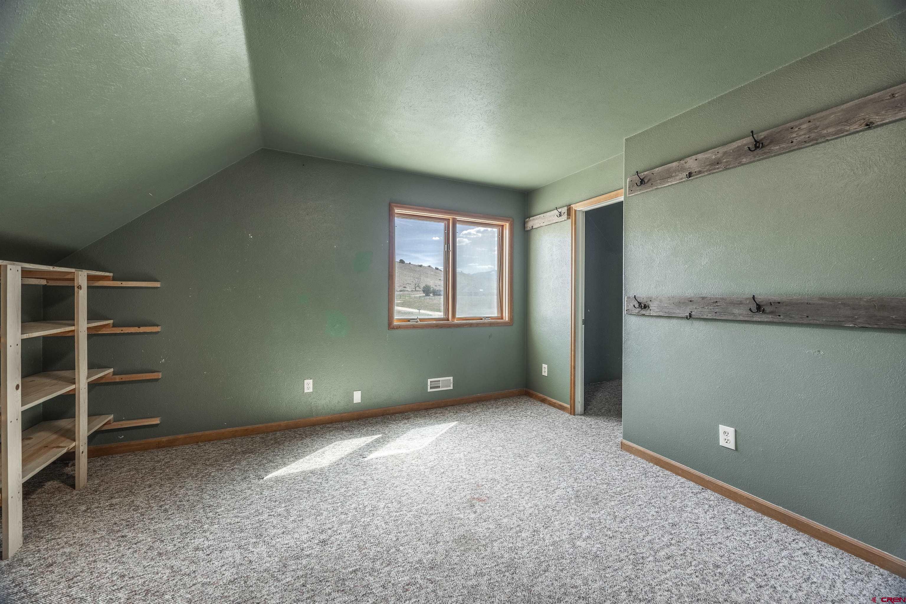 19555 6575th Road Montrose, CO 81403 - Photo 20 of 36 an empty room with a empty space and windows