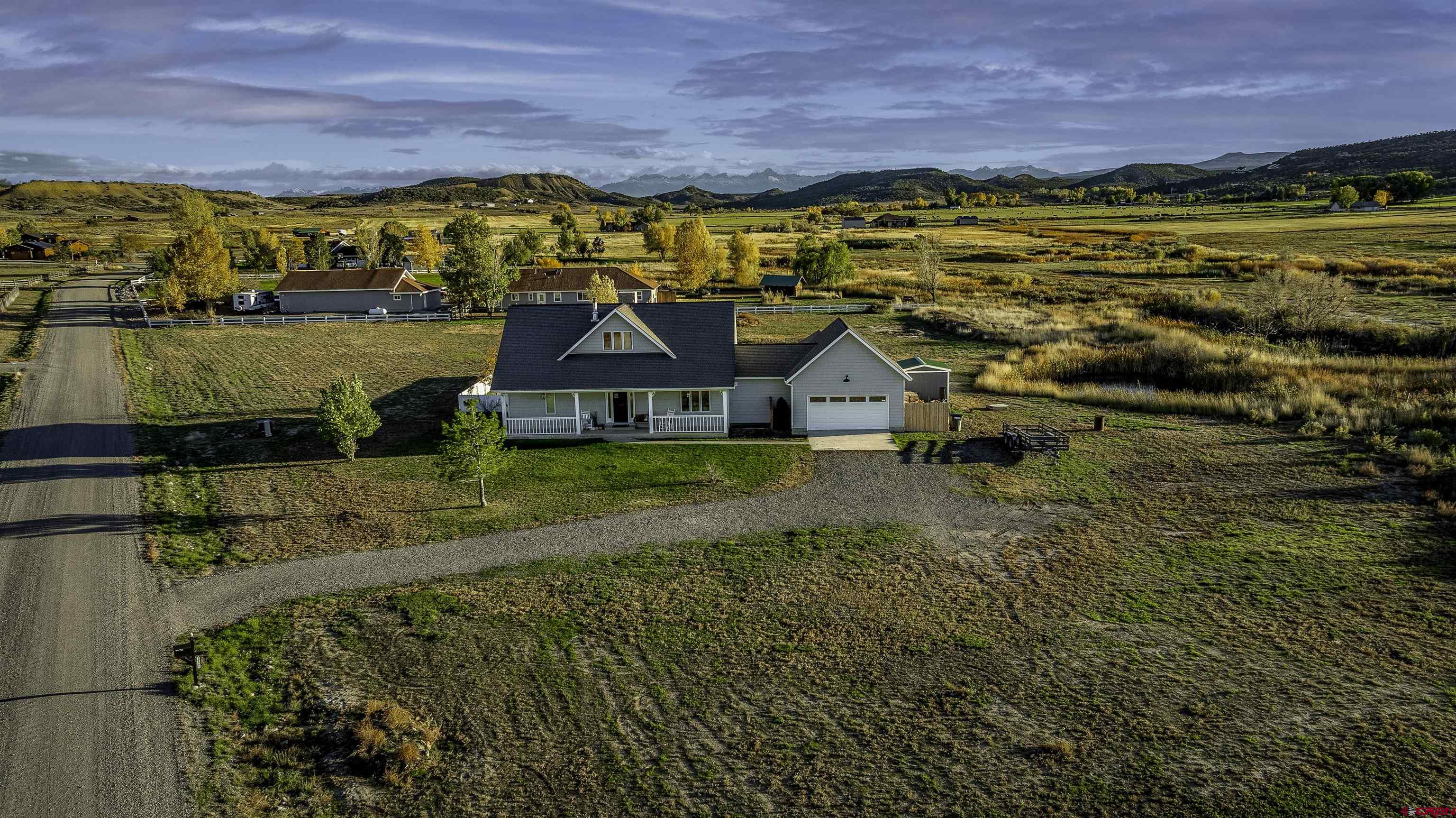 19555 6575th Road Montrose, CO 81403 - Photo 30 of 36 an aerial view of residential houses with outdoor space