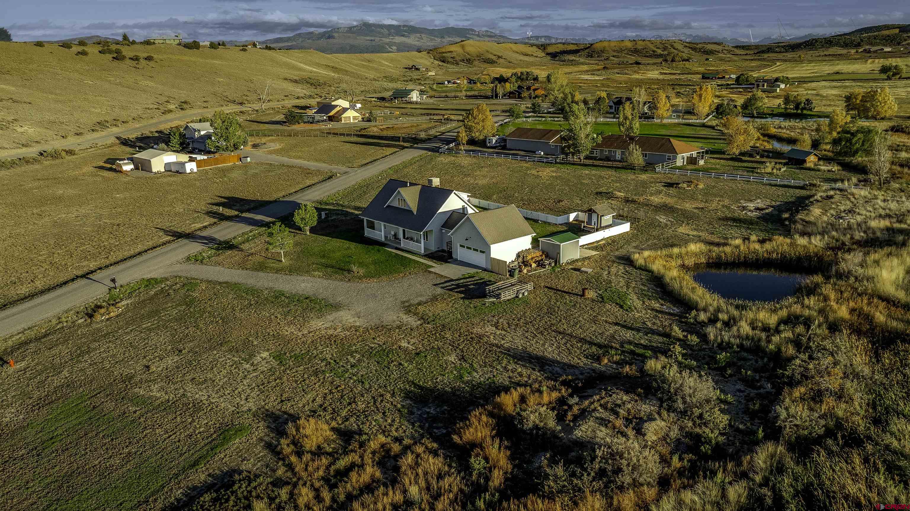19555 6575th Road Montrose, CO 81403 - Photo 31 of 36 an aerial view of residential houses with outdoor space