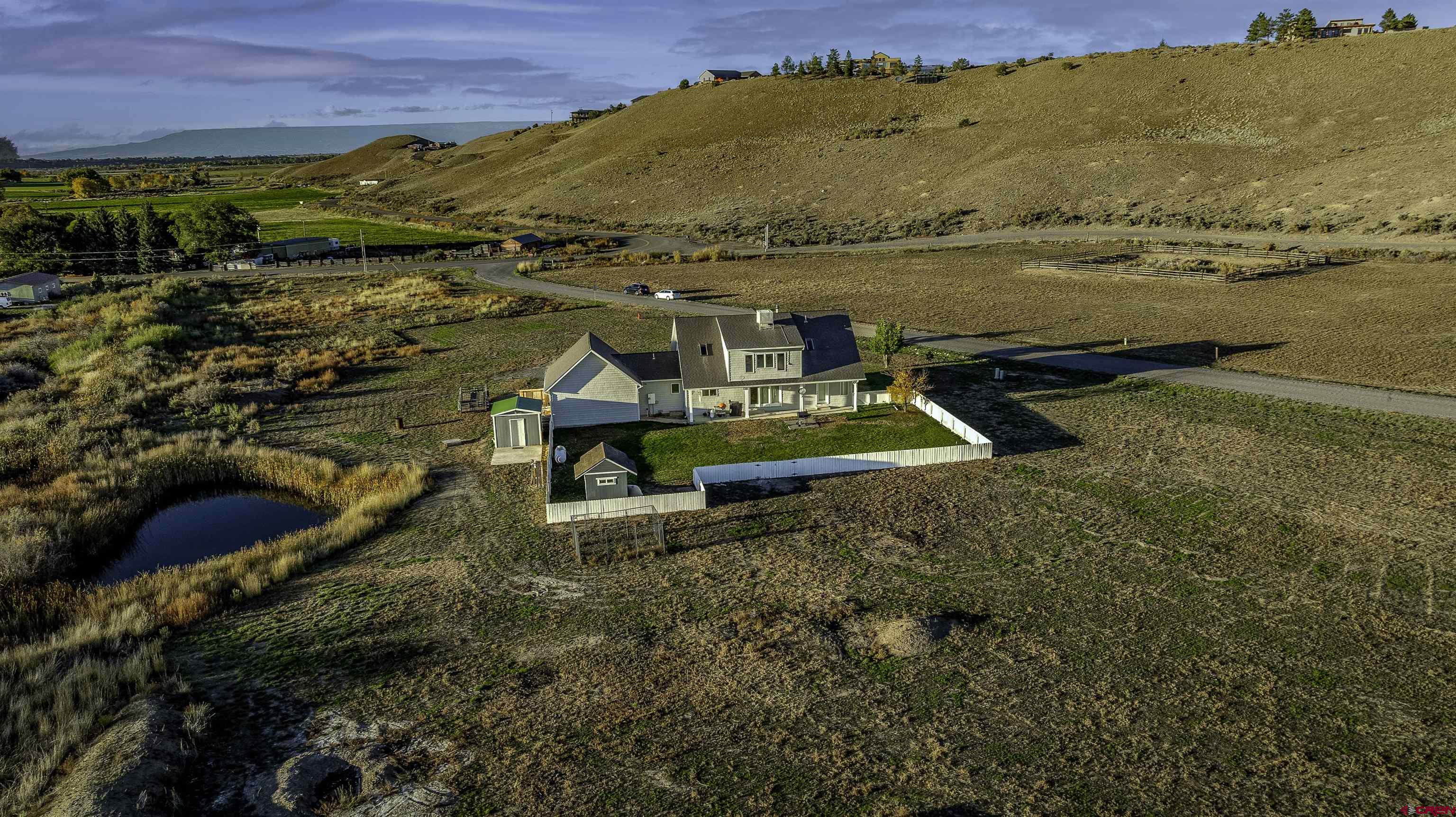 19555 6575th Road Montrose, CO 81403 - Photo 32 of 36 a view of a lake with a mountain