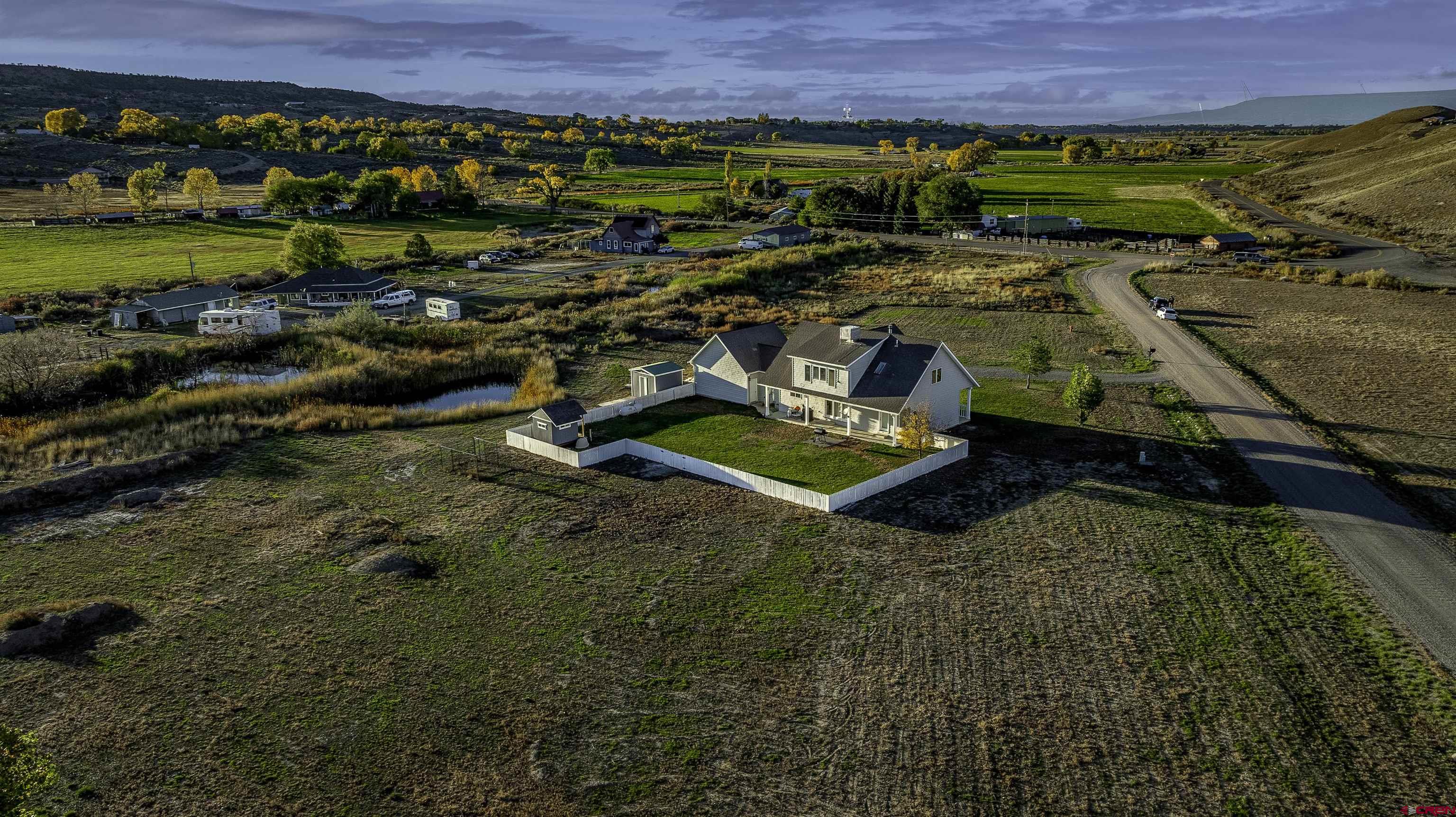 19555 6575th Road Montrose, CO 81403 - Photo 33 of 36 an aerial view of a house with a yard