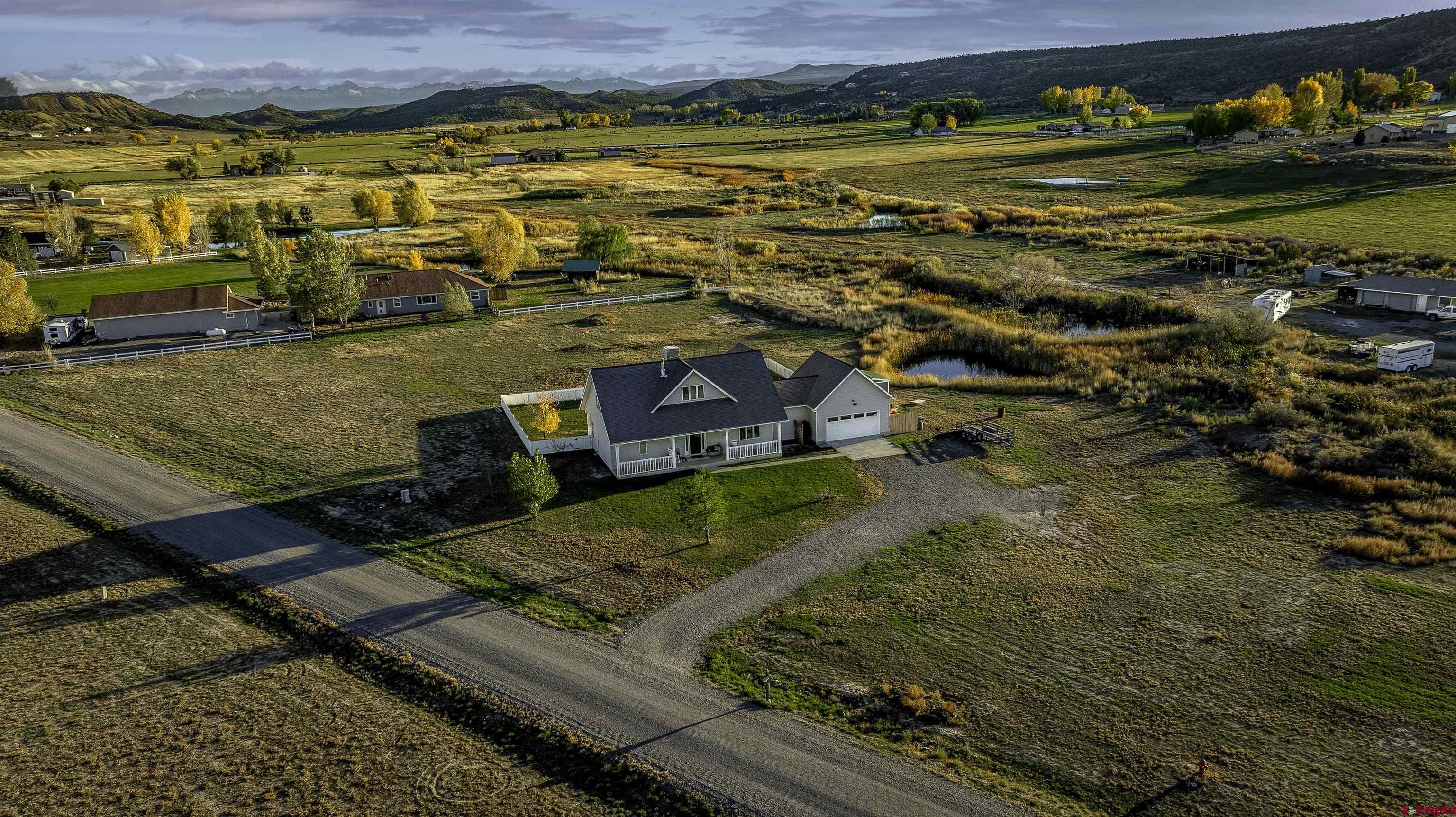 19555 6575th Road Montrose, CO 81403 - Photo 35 of 36 an aerial view of residential houses with outdoor space