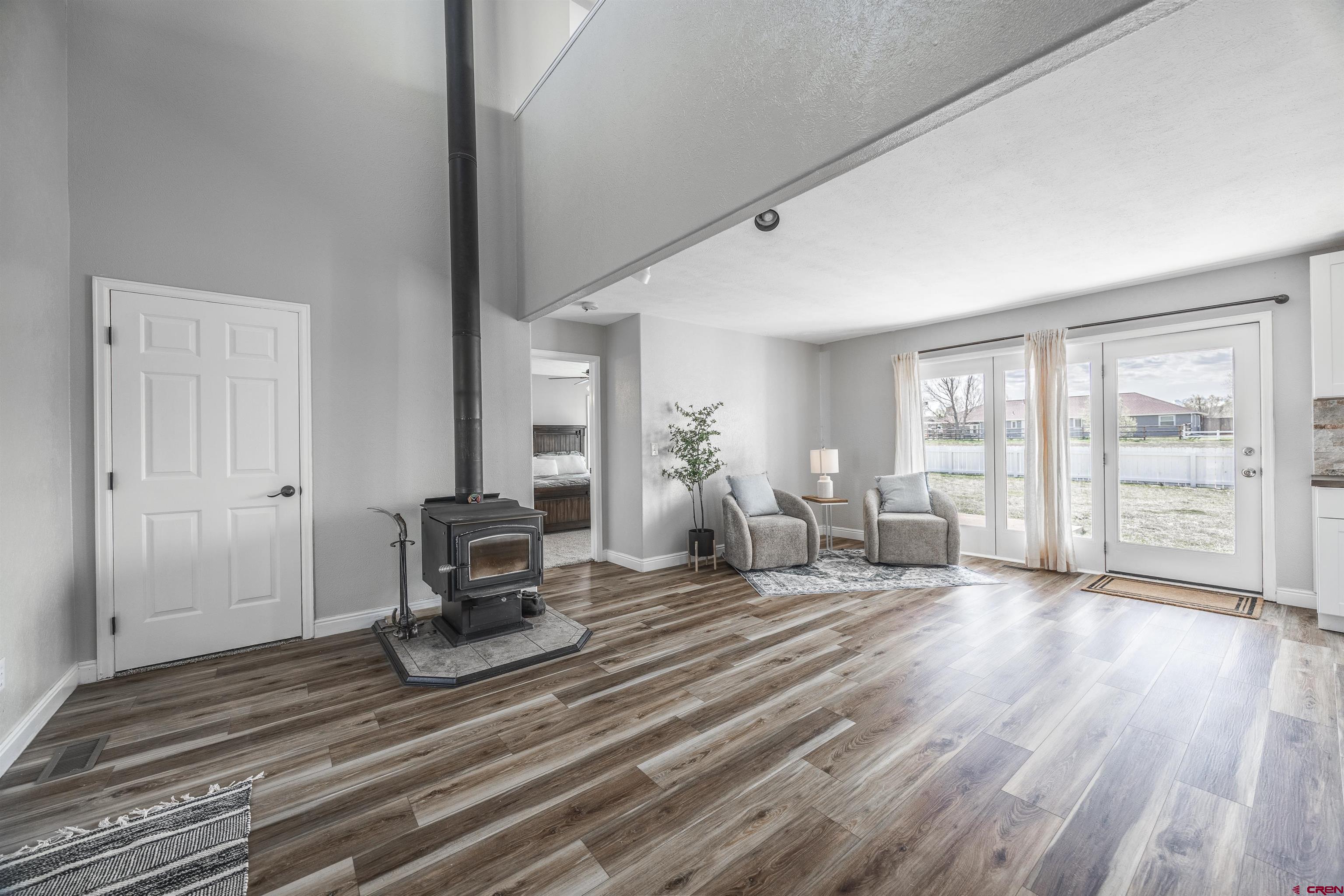 19555 6575th Road Montrose, CO 81403 - Photo 7 of 36 a bedroom with a bed and large window