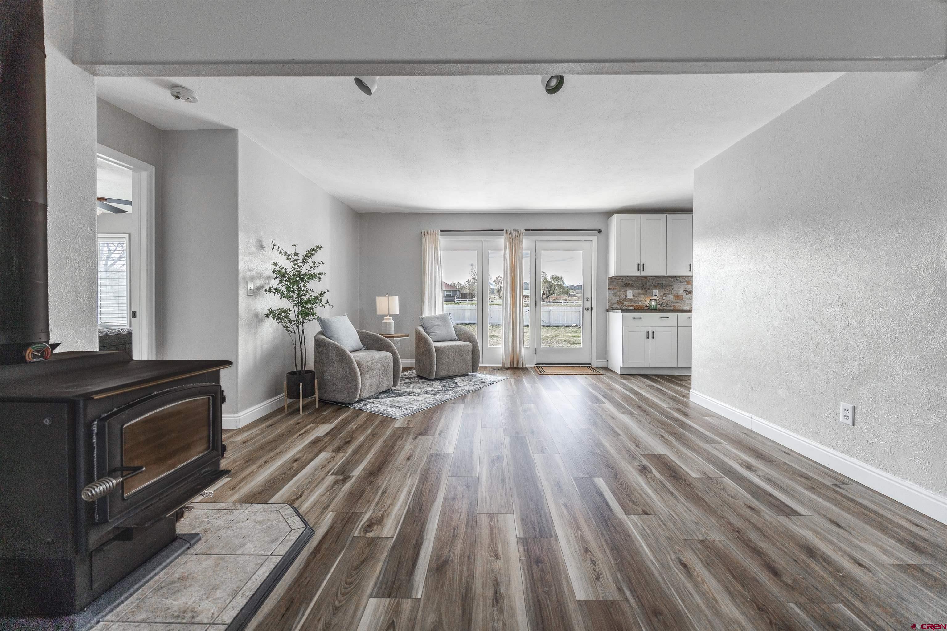 19555 6575th Road Montrose, CO 81403 - Photo 8 of 36 a living room with furniture and wooden floor