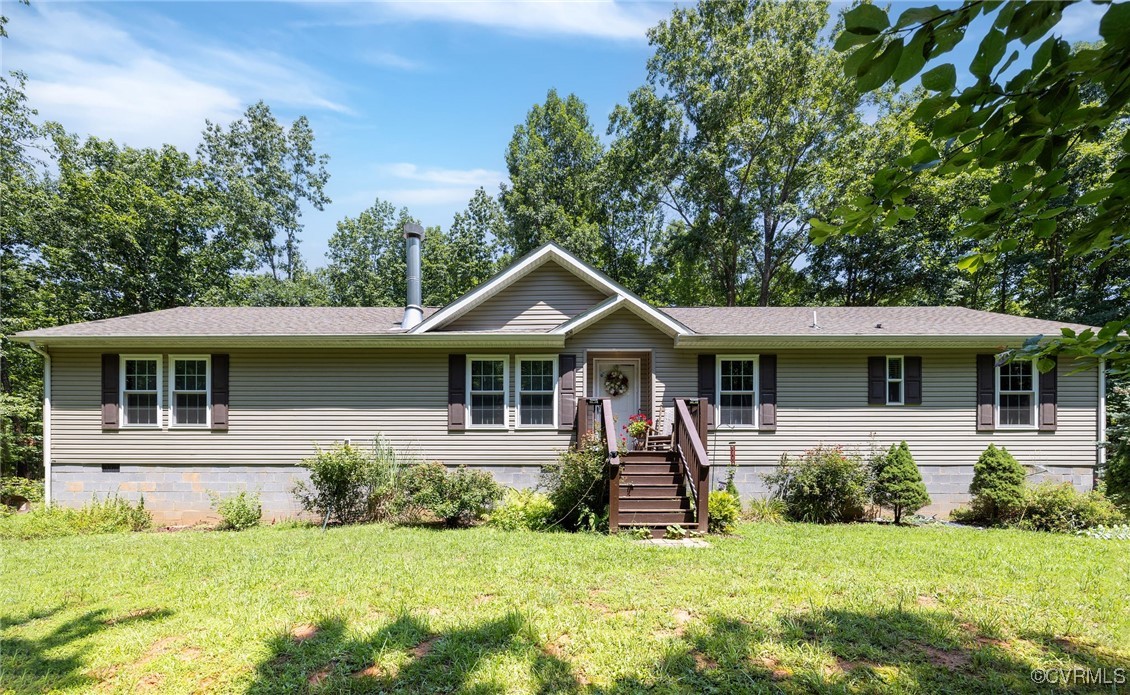 Ranch-style house with front yard.