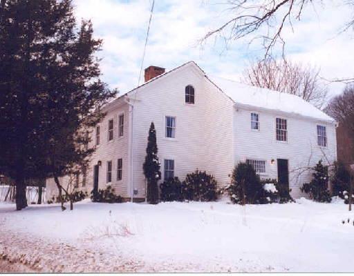 128 Huntingtown Road Newtown, CT 06470 - Photo 1 of 1 a front view of a house with a yard covered in snow