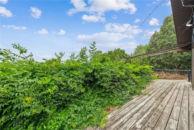 a view of balcony with wooden floor