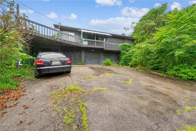 a house with swimming pool in front of it