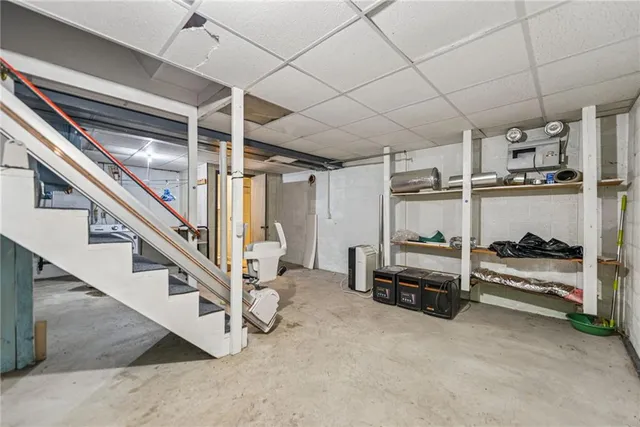 a view of a hallway with stairs