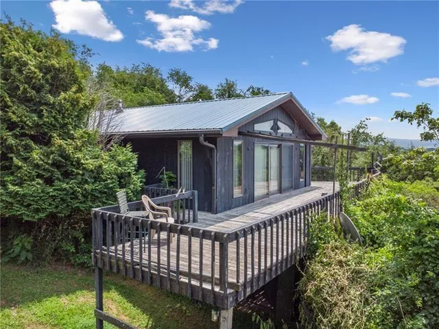 a view of a house with backyard and porch