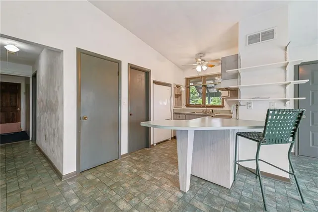 a room with a table and chairs