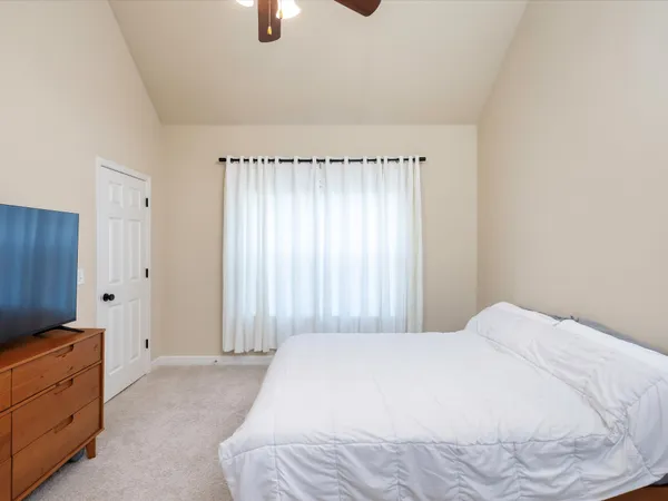 a bedroom with a bed and a cabinets