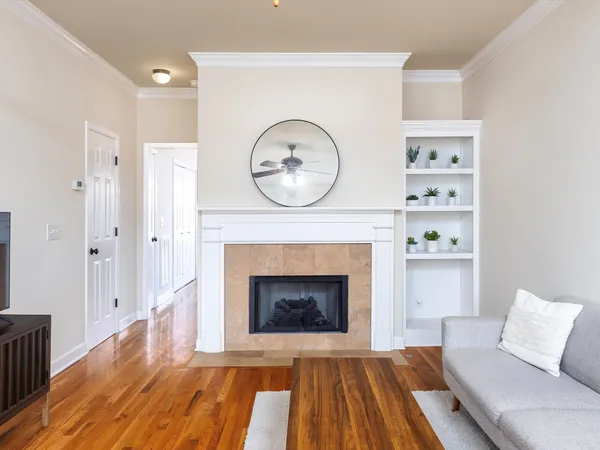 a living room with furniture and a fireplace