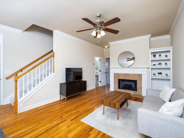 a living room with furniture and a fireplace