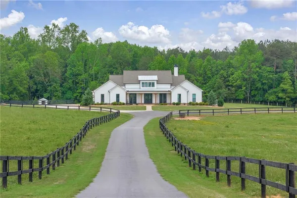 a view of a house with a big yard