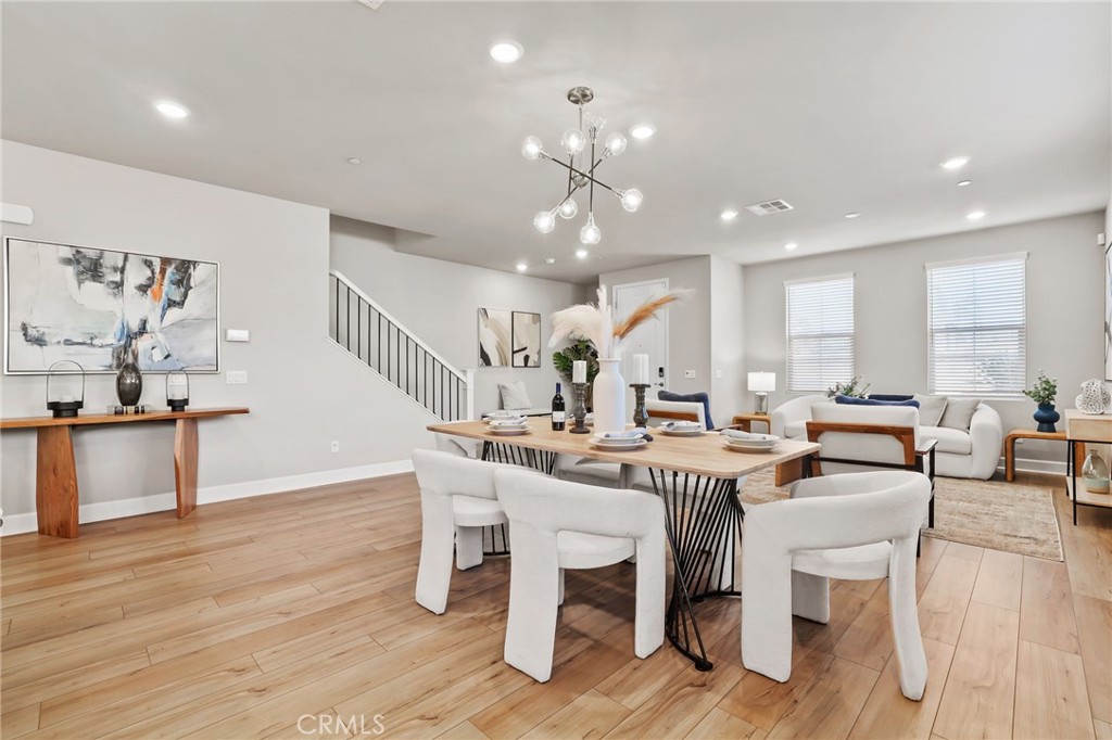 19091 Azul Lane Huntington Beach, CA 92648 - Photo 12 of 34 a view of a dining room with furniture and wooden floor