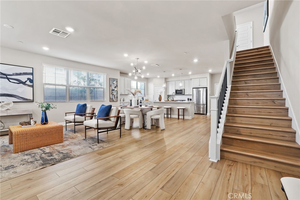 19091 Azul Lane Huntington Beach, CA 92648 - Photo 14 of 34 a living room with furniture and wooden floor