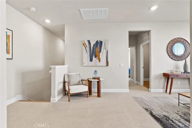 a bedroom with furniture and a lamp