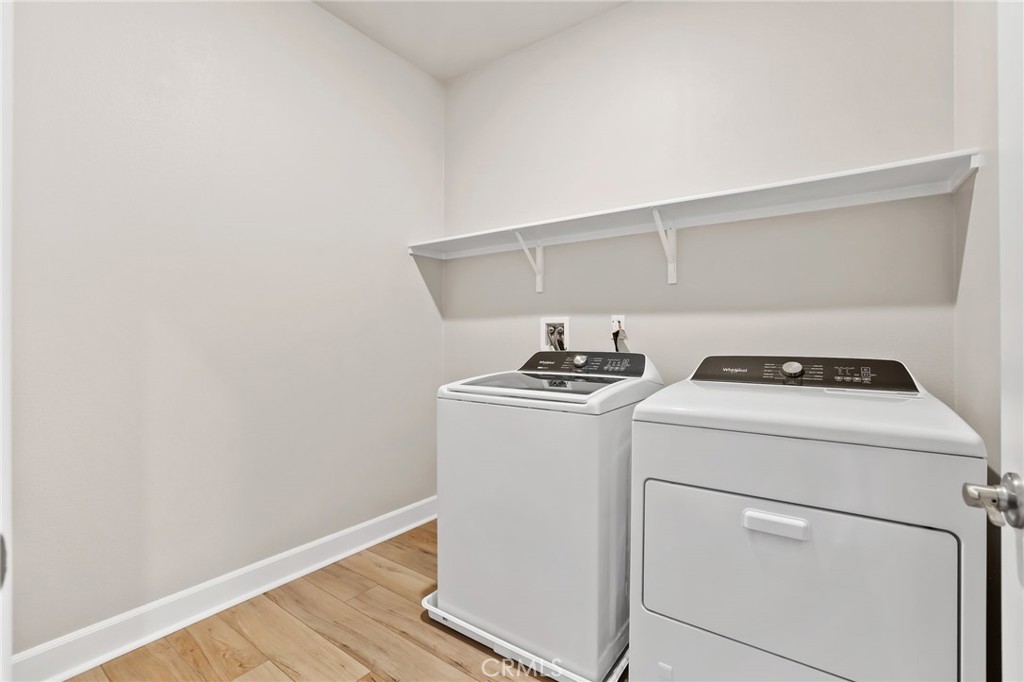 19091 Azul Lane Huntington Beach, CA 92648 - Photo 17 of 34 a utility room with dryer and washer