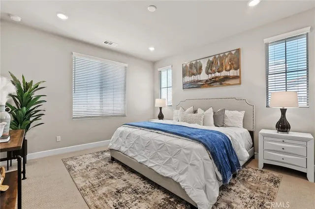 a bedroom with bed and a window