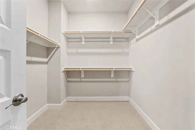 a view of an empty walk in closet