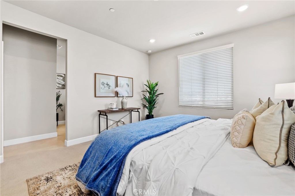 19091 Azul Lane Huntington Beach, CA 92648 - Photo 22 of 34 a bedroom with a bed and a painting on the wall