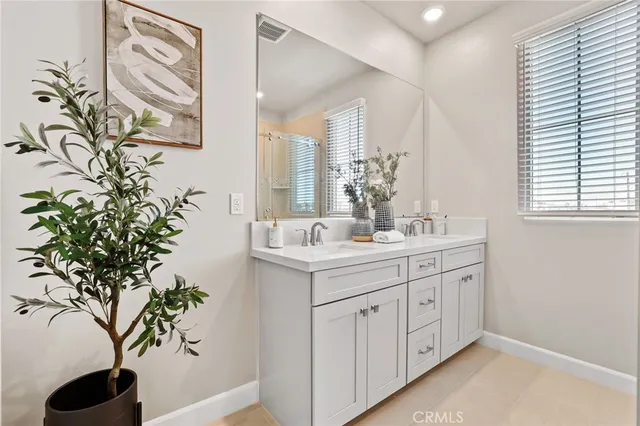 a bathroom with a sink and mirror