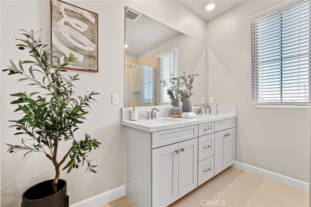 19091 Azul Lane Huntington Beach, CA 92648 - Photo 23 of 34 a bathroom with a sink and mirror