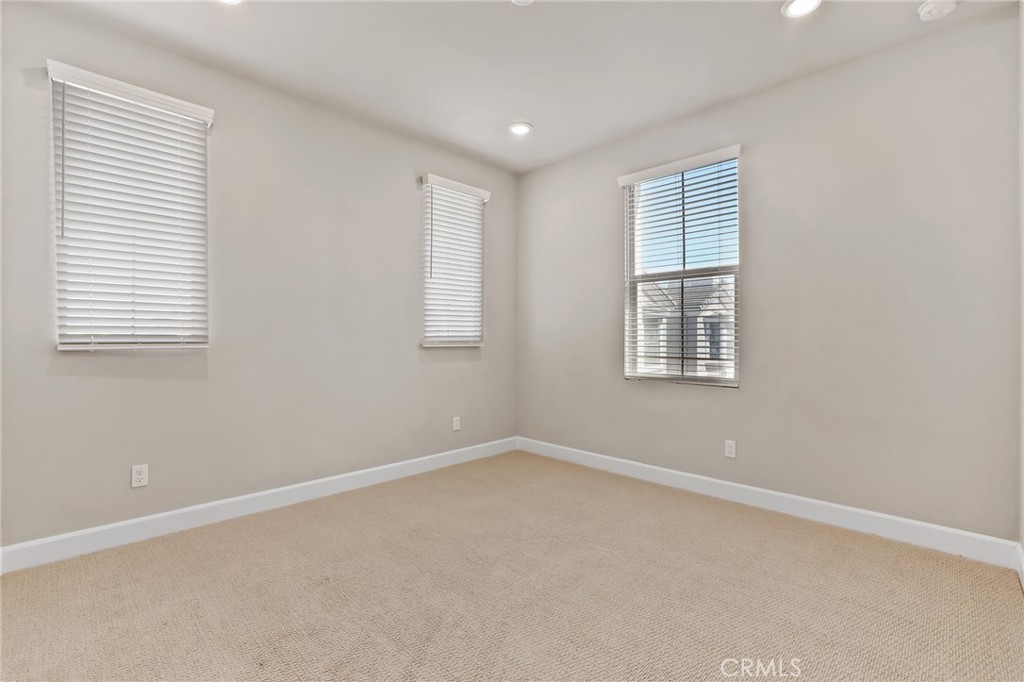 19091 Azul Lane Huntington Beach, CA 92648 - Photo 27 of 34 an empty room with windows