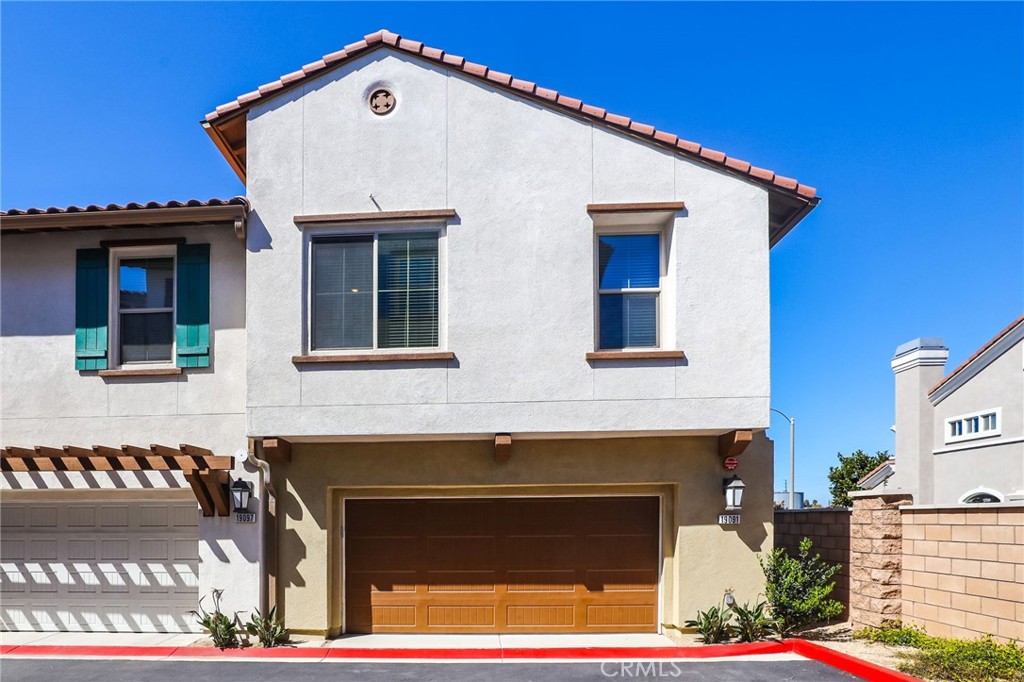 19091 Azul Lane Huntington Beach, CA 92648 - Photo 7 of 34 a front view of a house with parking