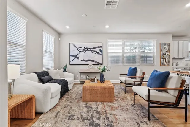 a living room with furniture and windows