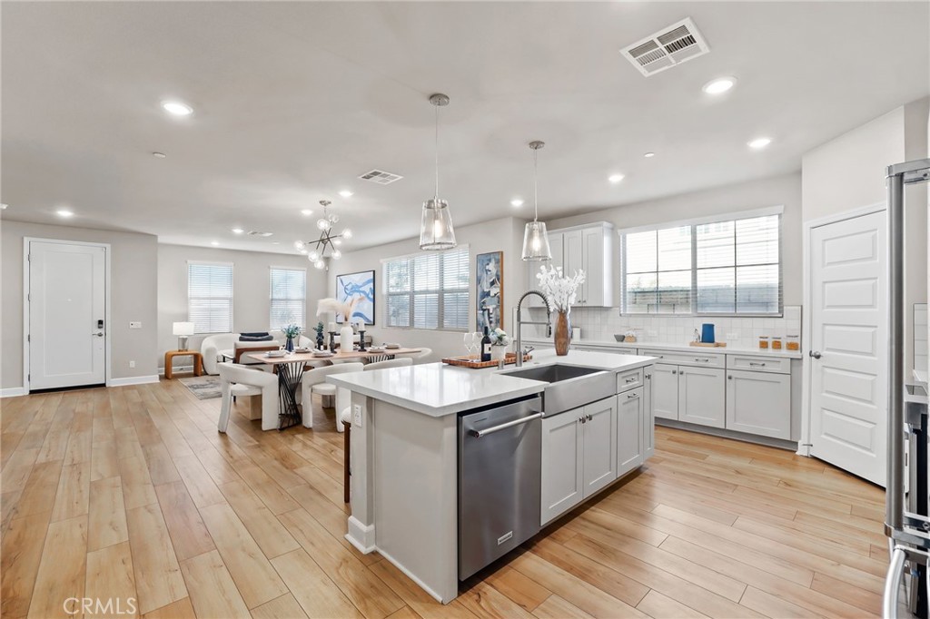 19091 Azul Lane Huntington Beach, CA 92648 - Photo 10 of 34 a kitchen with lots of counter top space and living room