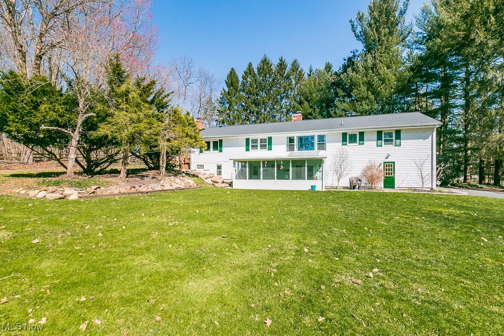 10495 Mulberry Road Chardon, OH 44024 - Photo 28 of 48 Back of house with plenty of space and view of sunroom